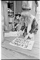 Image of Demonstrators making protest signs at McNeil Island ferry landing, February 1971