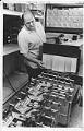 Image of Production worker Steve Taylor at Aldus checking packages of PageMaker, June 1, 1987