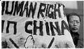 Image of Ye Kuo Rong holding sign protesting China's human rights record prior to APEC conference, Seattle, November 19, 1993