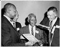 Image of Powell Barnett accepting Jackson Street Community Council Man of the Year award, Seattle, April 1964