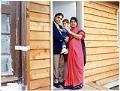 Image of Harish Bharti and family in doorway of their home, May 24, 1990