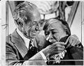 Image of Harry Bridges giving union badge to Dixy Lee Ray, Seattle, April 18, 1977