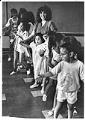 Image of Dorothy Cordova teaching Filipino folk dancing to children, Seattle, August 31, 1987
