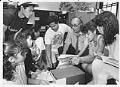 Image of Fred Cordova and students looking at Filipino American archive, Seattle, August31, 1987