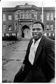 Image of Earl Debnam in front of Colman School, Seattle, July 1990