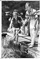 Image of Barbara Bergano and Lope Malle roasting a pig at Seafair Fiesta Filipina, Seattle, August 7, 1971