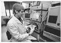 Image of Dace Krasts working in lab at Immunex, Seattle, July 23, 1992