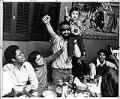 Image of Roberto Maestas, Larry Gossett and others celebrating in restaurant , Seattle, December 26, 1972