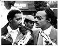 Image of Jim Mason and Eddie Rye, Jr. talking to press, Spetember 15, 1986