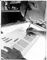 Image of Chuck McClellan working on magazine at McNeil Island Penitentiary, January 3, 1975