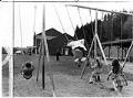 Image of Children on swings at McNeil Island playground, April 19, 1972