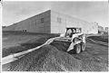 Image of Skid-steer loader clearing grounds for new Microsoft plant, Bothell, December 30, 1987