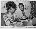 Image of Ray Seales and his mother with his Olympic gold medal, circa 1973