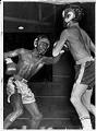 Image of Ray Seales and Ray Haley boxing at Tacoma Golden Gloves prelinimaries, January 1970