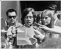 Image of Jeff Bickford reading SLF statement after arrests, April 17, 1970
