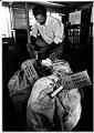 Image of Ron Sims fastening tags to sacks of campaign mail, Seattle, September 13, 1985