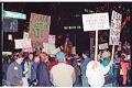 Image of Demonstrators with signs outside Westin Hotel  prior to APEC conference, Seattle, November 19, 1993