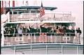 Image of APEC conference attendees waving from boat at Tillicum Village, Blake Island, November 20, 1993