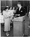 Image of Nina Rivera receiving U.S. naturalization papers, Seattle, July 2, 1952