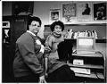 Image of Bettylou Valentine and Rebecca Salinas-Burton with student in Central Youth and Family Services office, Seattle, January 2, 1990