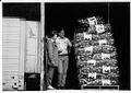 Image of Ruth Velozo and Bob Boogert watching the unloading of food donation at Northwest Harvest, Seattle, November 17, 1992