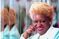 Image of DeCharlene Williams in her beauty salon, August 6, 1993