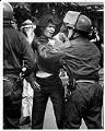 Image of Emile Wilson and police officer at Seattle University protest, May 21, 1970