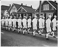 Image of Men marching in a Mardi Gras parade, Seattle, circa 1956