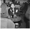 Image of Woman sitting at table at the Basin Street nightclub, Seattle, September 1945