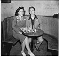 Image of Couple sitting in booth at Basin Street nightclub, Seattle, September 1945