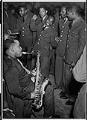 Image of Pete Peterson playing saxophone for a group of servicemen, Seattle, circa 1944