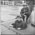 Image of Battery Street Tunnel tenders at manhole, February 2, 1960