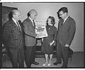 Image of Four people with poster for Israel Emergency Fund benefit concert, Seattle, August 1967