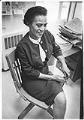 Image of Roberta Byrd Barr sitting at desk, May 4, 1967