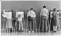 Image of Lucette Lightfoot and her daughter at voting booth, Seattle, September 20, 1988