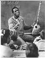 Image of Won Ldy Paye with students at McGilvra Elementary School, February 19, 1988