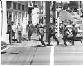 Image of Police running to demonstration at Summit Branch of Seattle Community College, May 23, 1969