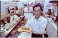 Image of Counterman with banh mi sandwich at Vietnamese deli, Seattle, January 14,1993