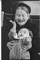Image of An Tran holding baby during reunion at SeaTac airport, February 23, 1993