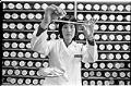 Image of Chu-Lan Chiong weighing medicinal herbs, Seattle, March 1, 1993