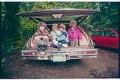 Image of Children sheltering from rain at campground, June 22, 1993