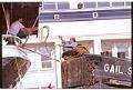 Image of Man on tug Gail S tossing rope to man on the Wawona, June 23, 1993