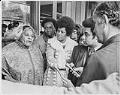 Image of Flo Ware speaking to Governor Dan Evans in front of Liberty Bank, April 7, 1972