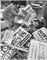 Image of Cleaning up campaign signs along Rainier Avenue, Seattle, November 9, 1977