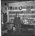 Image of Rev. O.S. Thomas Lewis in his office, Seattle, circa 1950