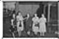 Image of Five women posing in front of a house, circa 1950