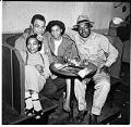 Image of Four people in a booth at the Basin Street  nightclub, July 1945