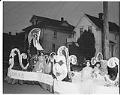 Image of Royalty riding on Mardi Gras parade float, Seattle, circa 1954