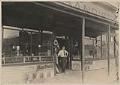 Image of Merl Middleton at front door of Middleton Grocery, Seattle, circa 1910