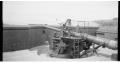 Image of John Young standing on disappearing gun platform at Fort Worden, 1936